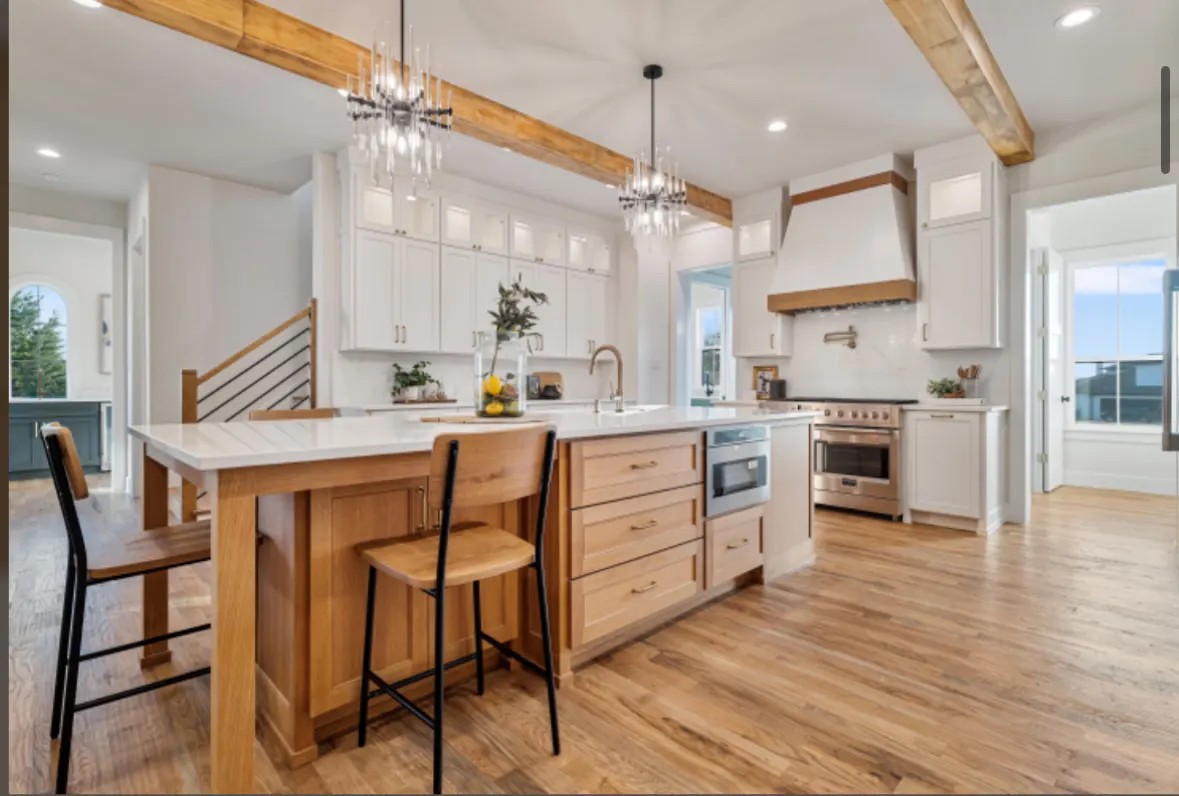 Knollwood kitchen with exposed beams and a white range hood
