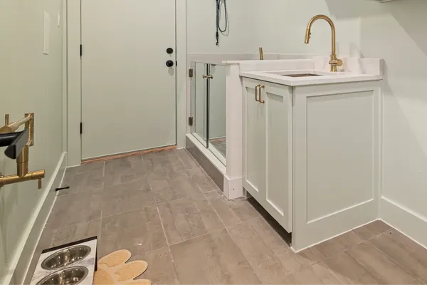 Laundry room with a utility sink