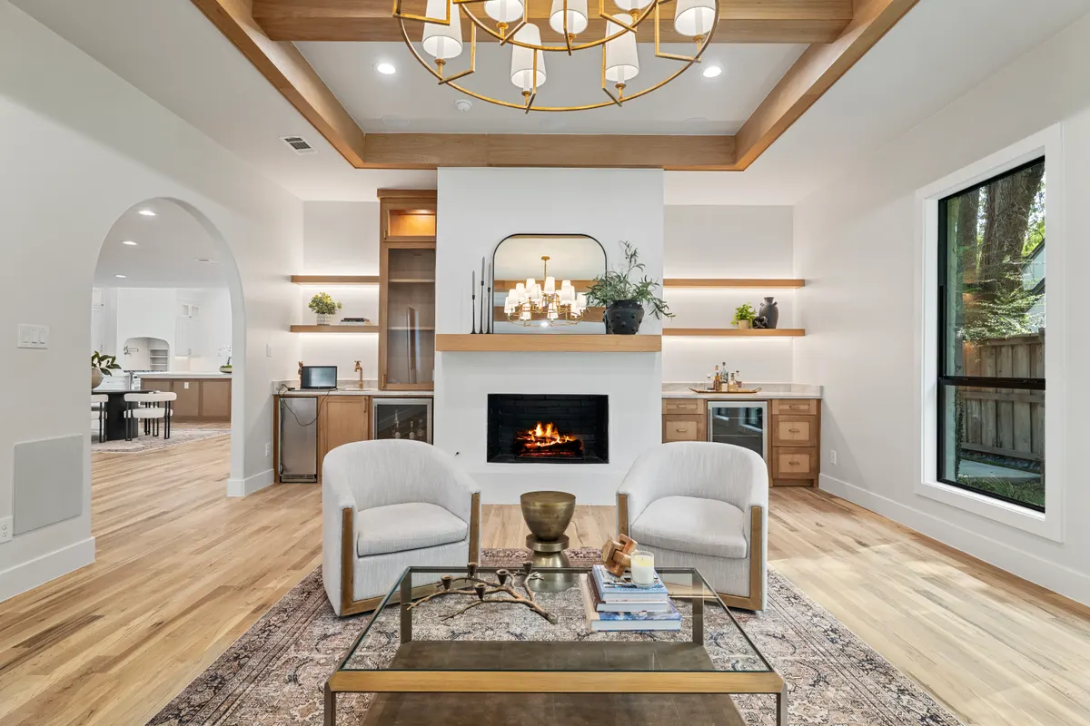 Forest Creek living room with a fireplace between floating shelves
