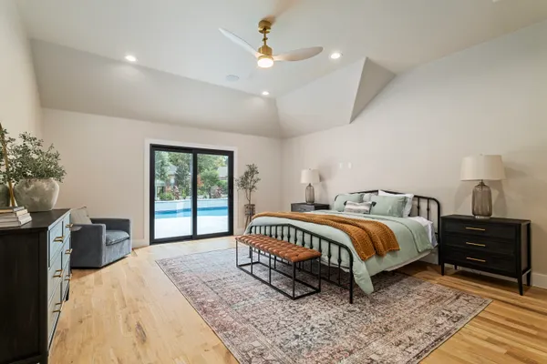 Bedroom with sliding doors out to the pool
