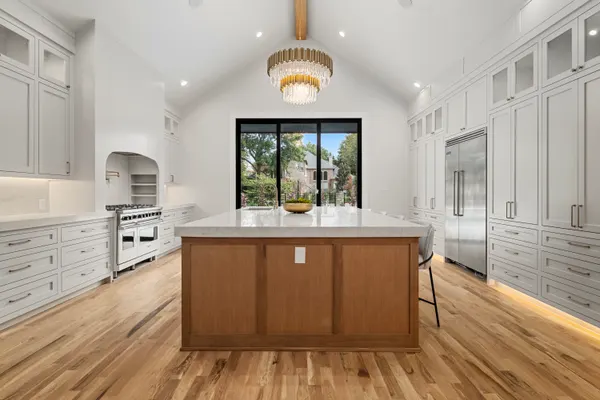 Kitchen from the end of the island, with sliding doors on the far wall