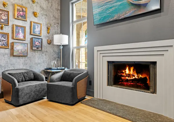 Sitting area by the fireplace, with a stone accent wall