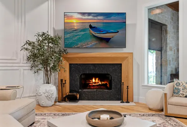 Living room fireplace framed in white oak