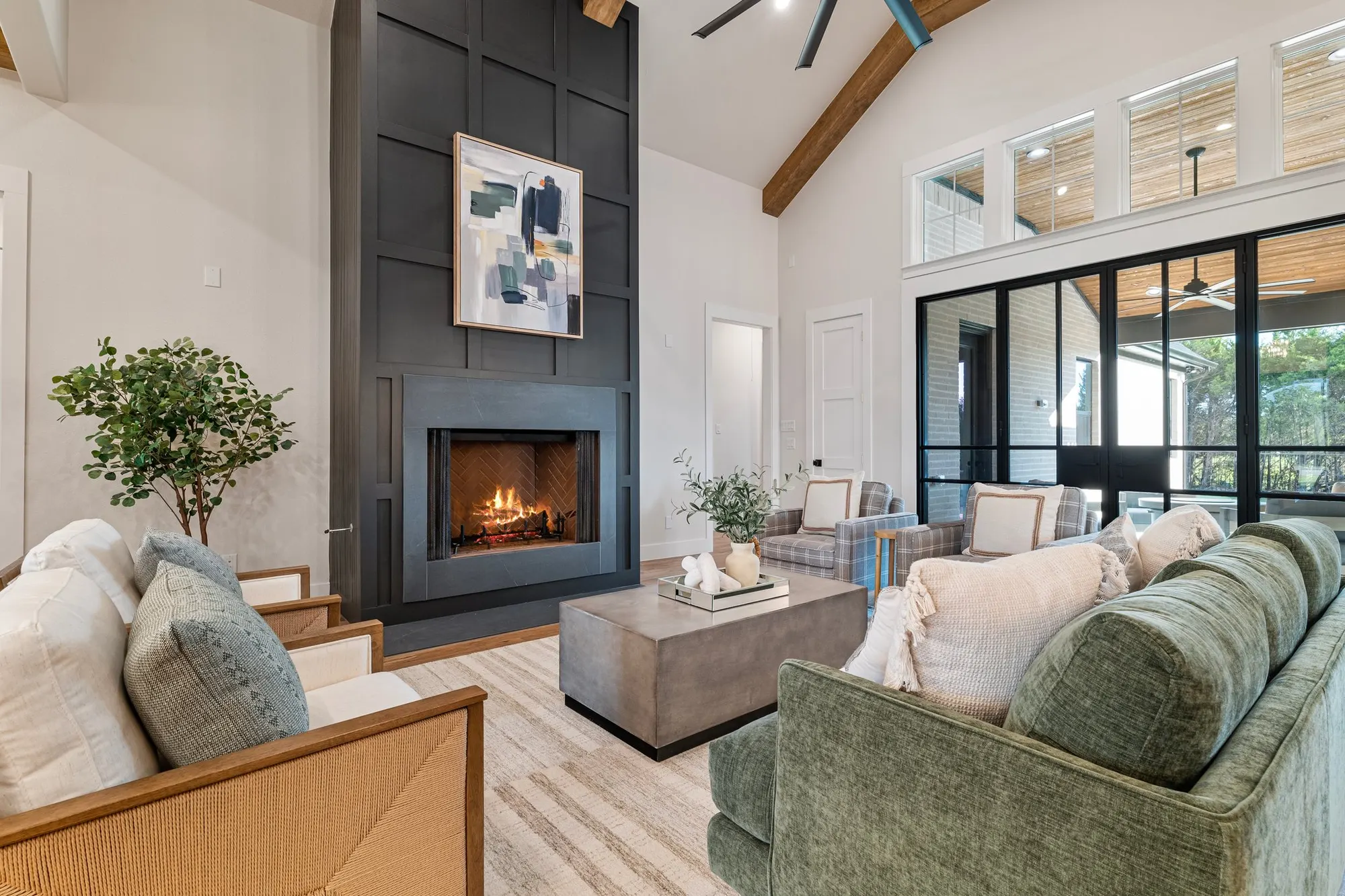 Great room with fireplace and vaulted ceiling in a new SJ4 build